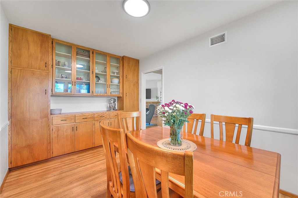 4845 Granada Avenue Riverside, CA 92504 - Photo 37 of 56 a view of a dining room with furniture window and wooden floor