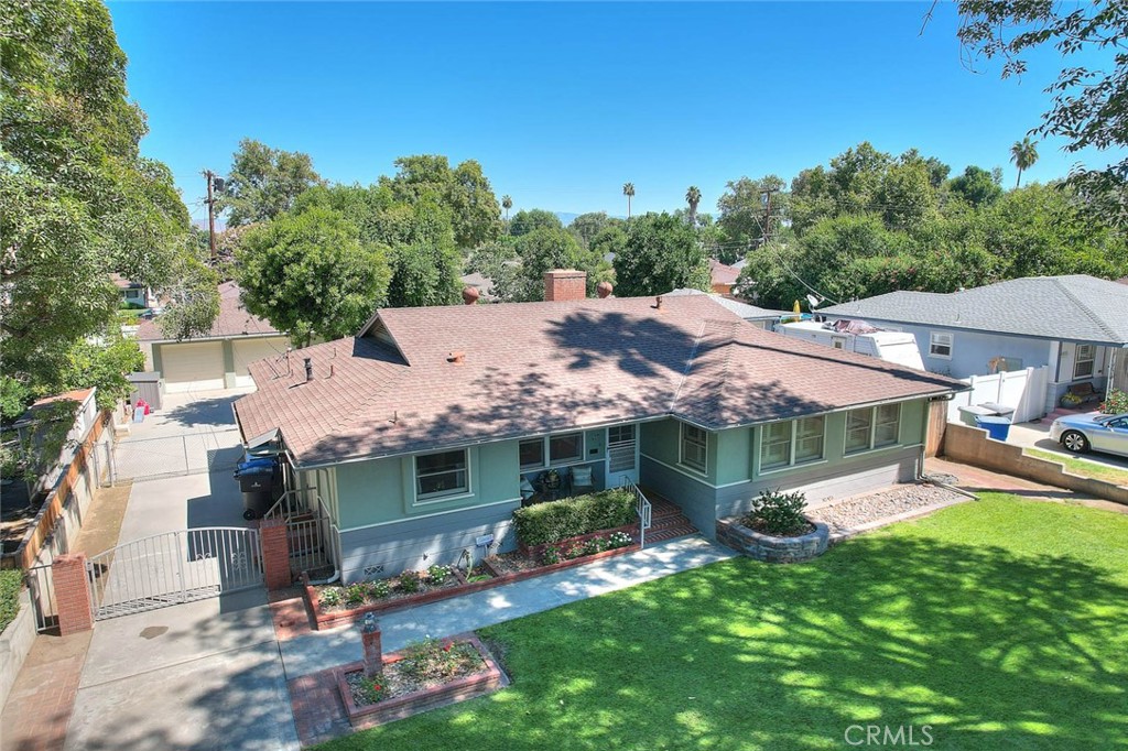 4845 Granada Avenue Riverside, CA 92504 - Photo 6 of 56 an aerial view of a house with a yard table and chairs