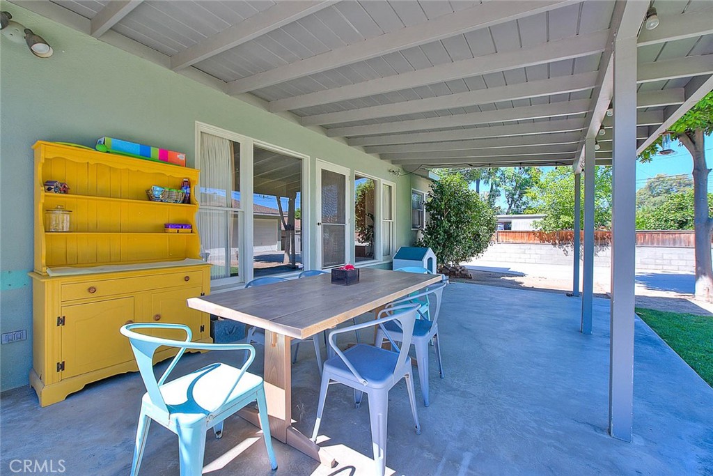 4845 Granada Avenue Riverside, CA 92504 - Photo 9 of 56 a view of a dining room with furniture and wooden floor