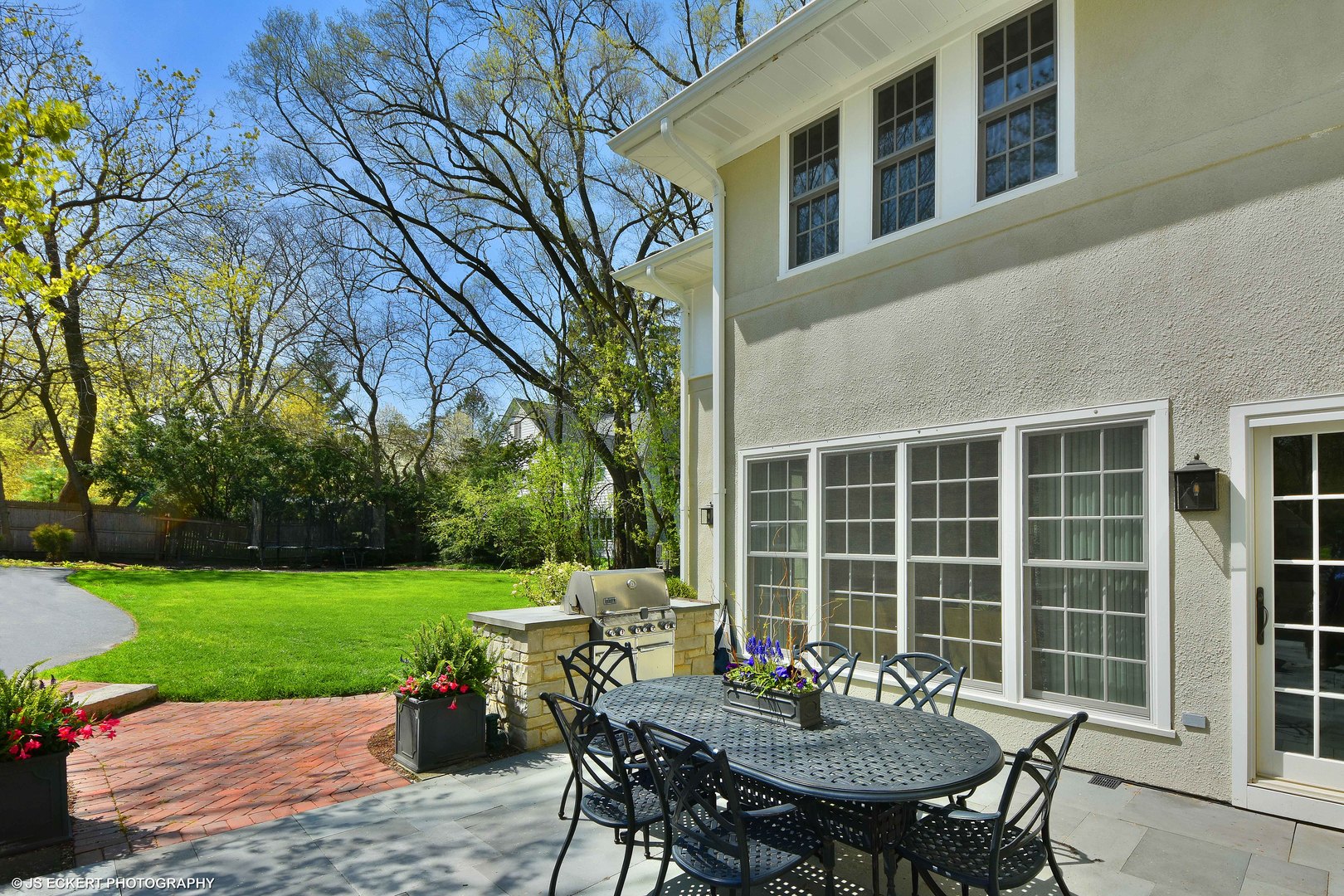 580 Washington Road Lake Forest, IL 60045 - Photo 41 of 46 a view of a table and chairs in back yard of the house