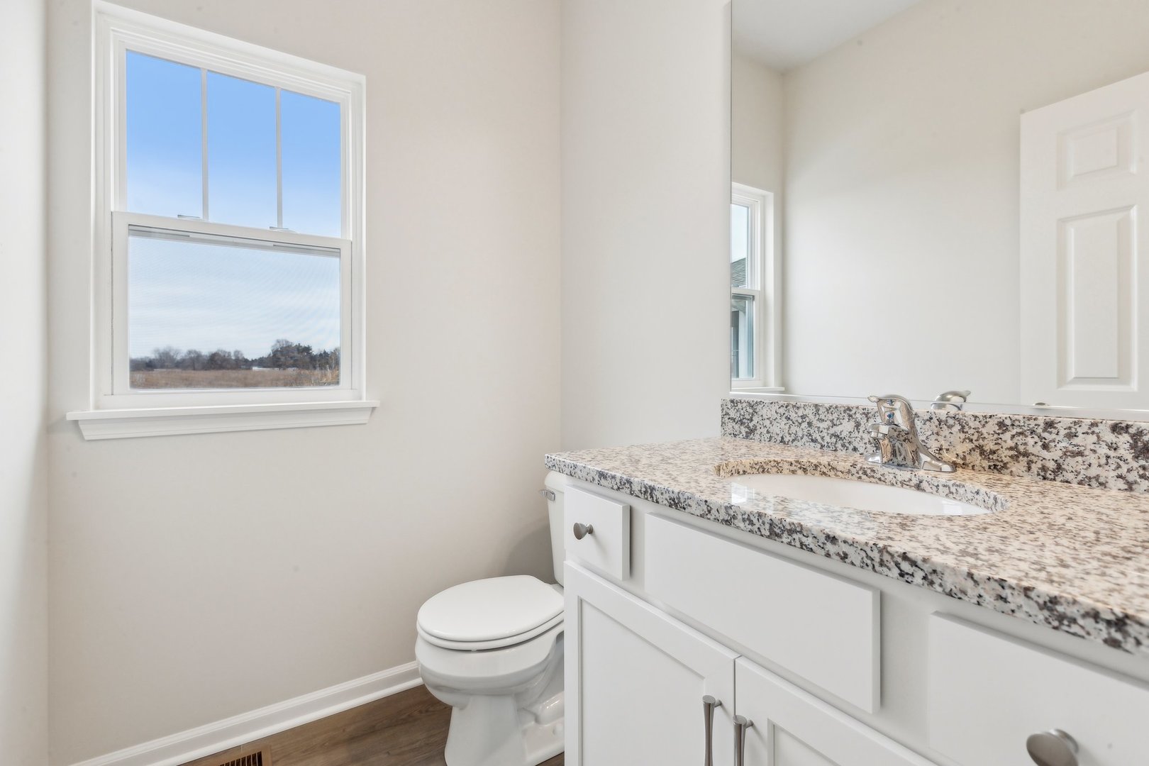 737 Cherry Circle Elburn, IL 60119 - Photo 16 of 50 a bathroom with a granite countertop toilet sink and mirror