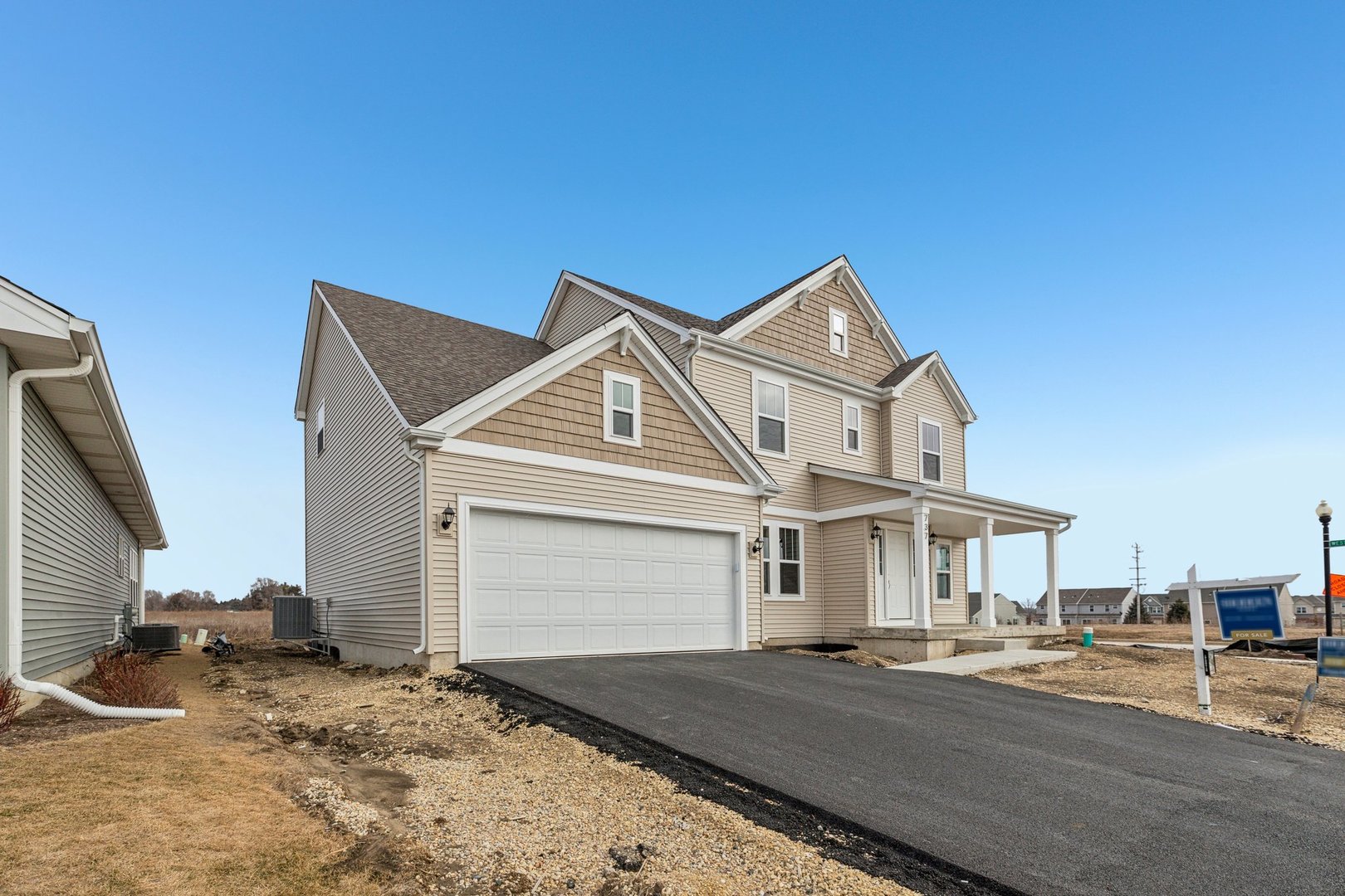 737 Cherry Circle Elburn, IL 60119 - Photo 2 of 50 a front view of a house with a yard