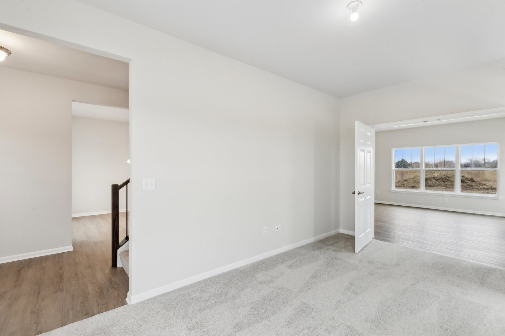 737 Cherry Circle Elburn, IL 60119 - Photo 22 of 50 a view of empty room with wooden floor and fan