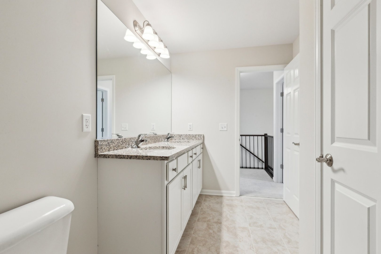 737 Cherry Circle Elburn, IL 60119 - Photo 46 of 50 a bathroom with a granite countertop sink a toilet and a mirror