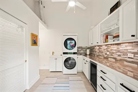 a view of a backyard with plants and a garden