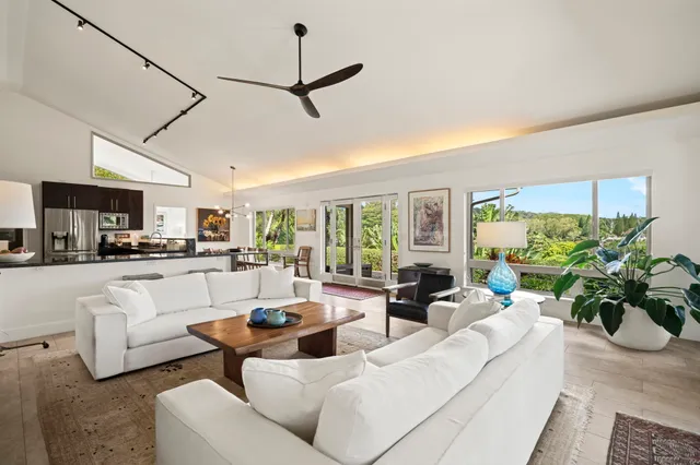 a kitchen with a table chairs refrigerator and microwave
