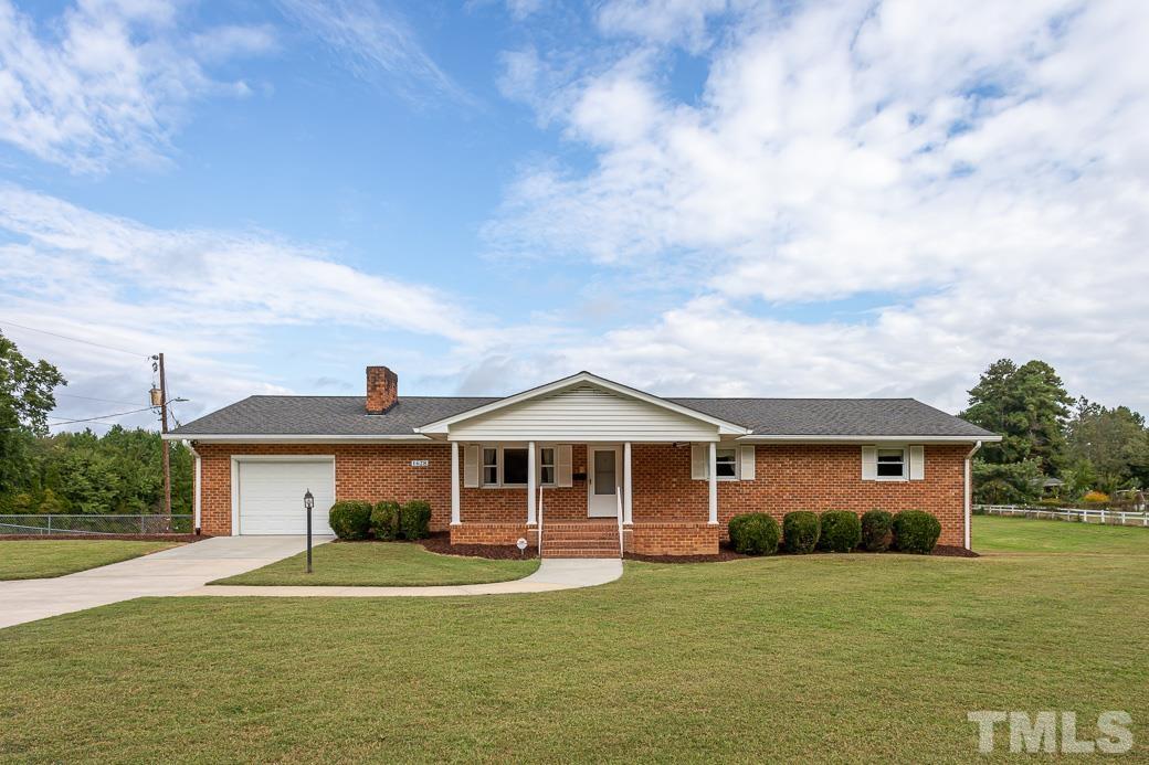 Over 5500 sq ft w/Multiple Garages, Guest House, and Workshop Space.  Finished Basement w/ Full Bath, Entertainment Area and Fireplace.