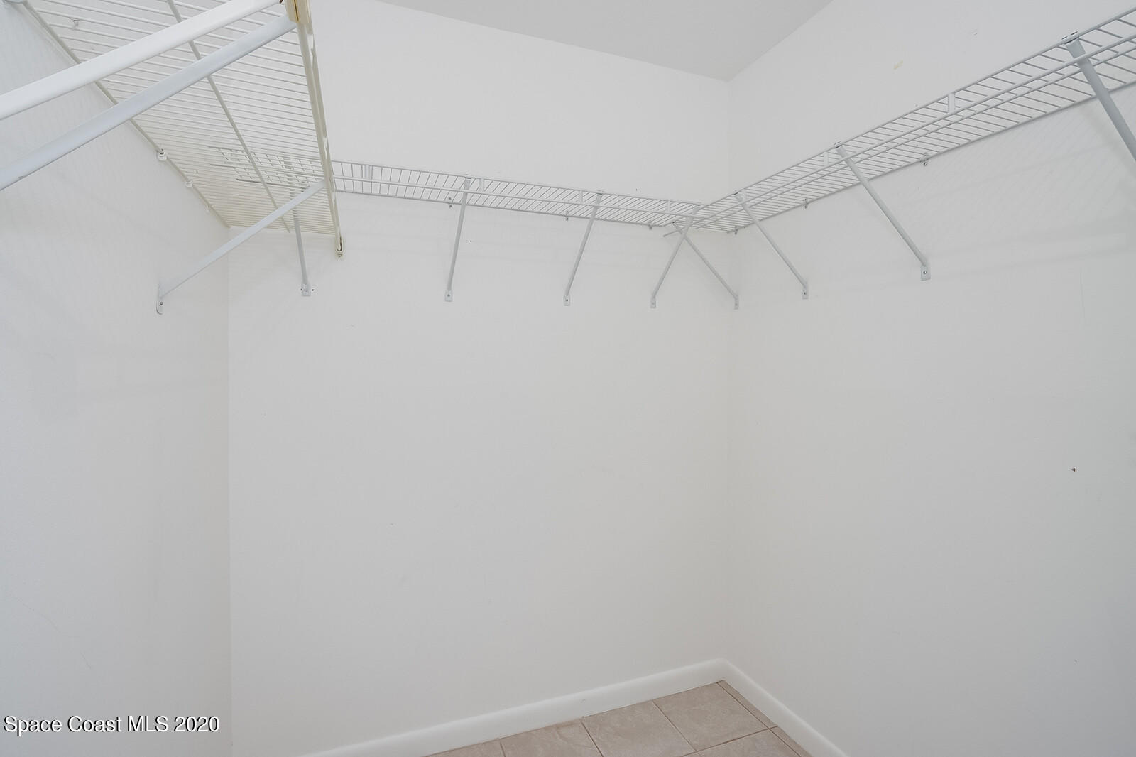 302 Stendal Road Northwest Palm Bay, FL 32907 - Photo 13 of 22 Owner's suite walk in closet