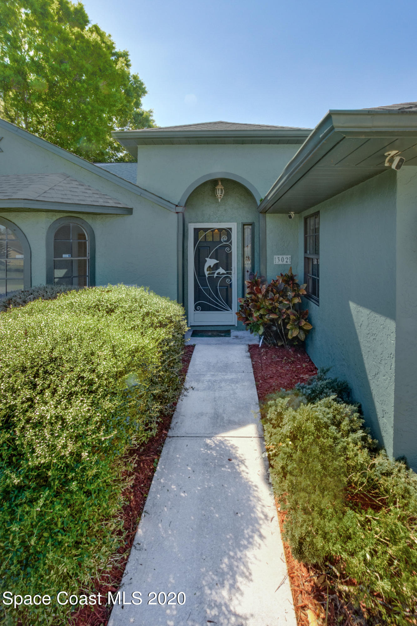 302 Stendal Road Northwest Palm Bay, FL 32907 - Photo 21 of 22 Front walk