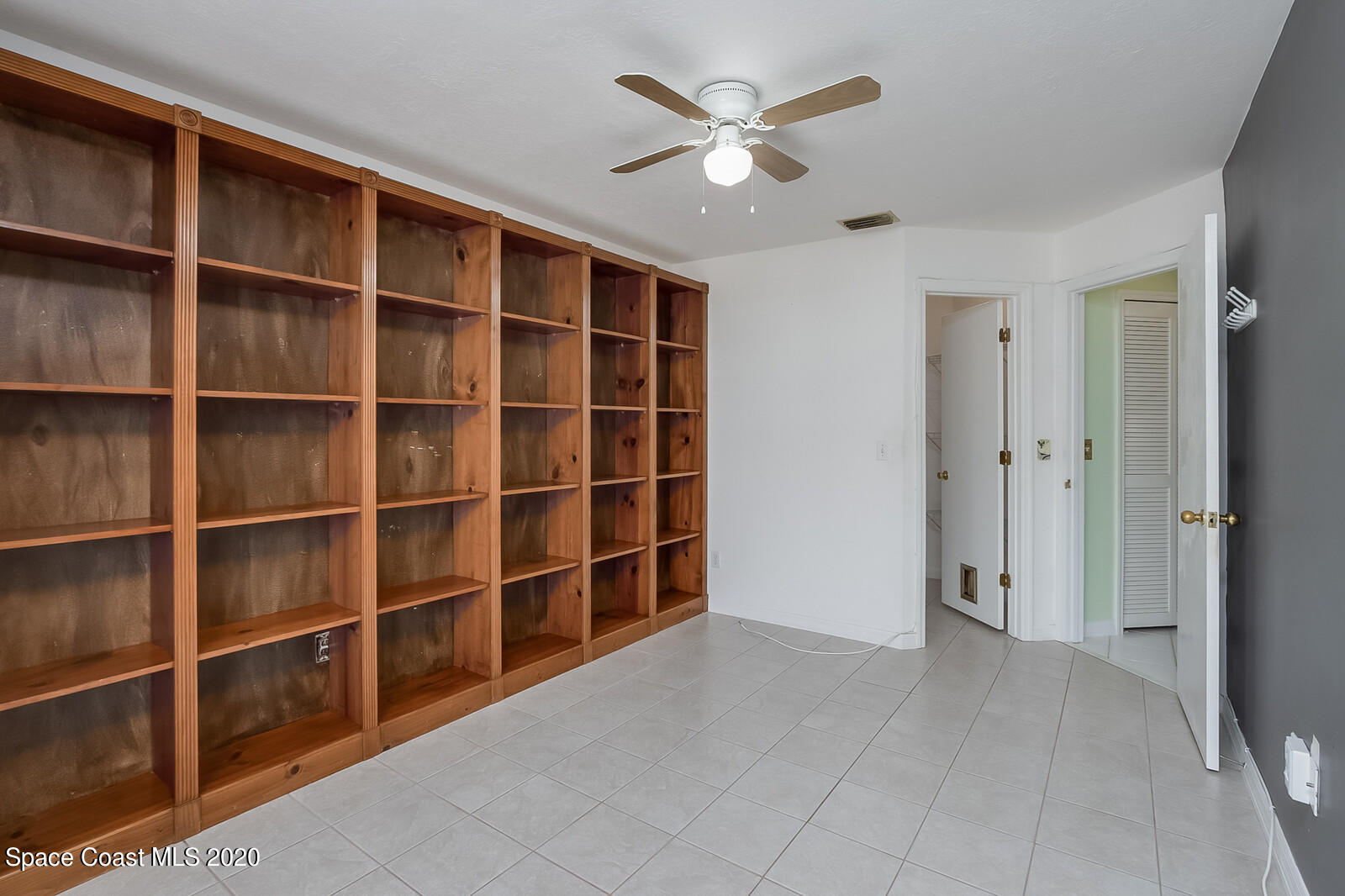 302 Stendal Road Northwest Palm Bay, FL 32907 - Photo 8 of 22 Office bookshelves