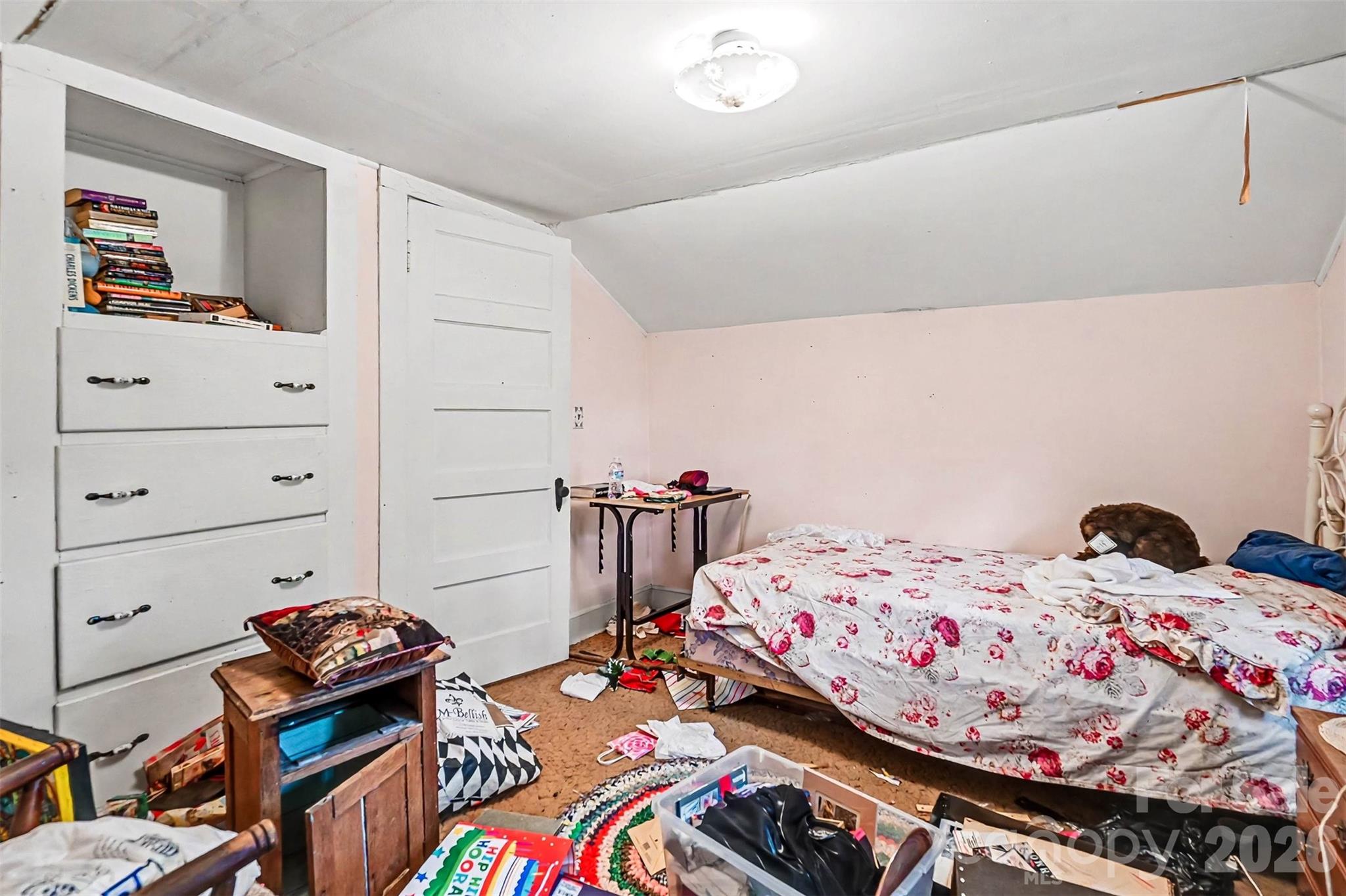 1116 Medlin Road Monroe, NC 28112 - Photo 11 of 40 a bedroom with a bed and dresser