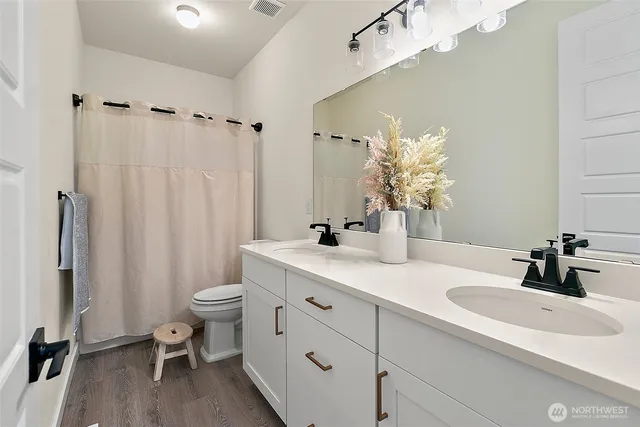 a bedroom with bed and a desk