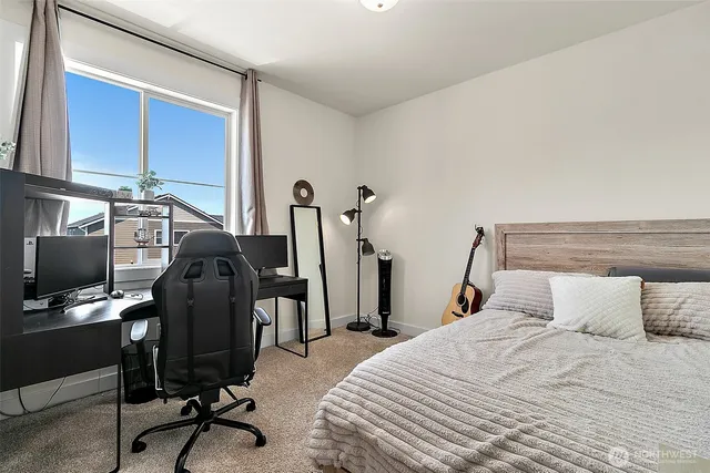 a bedroom with a bed furniture and a window
