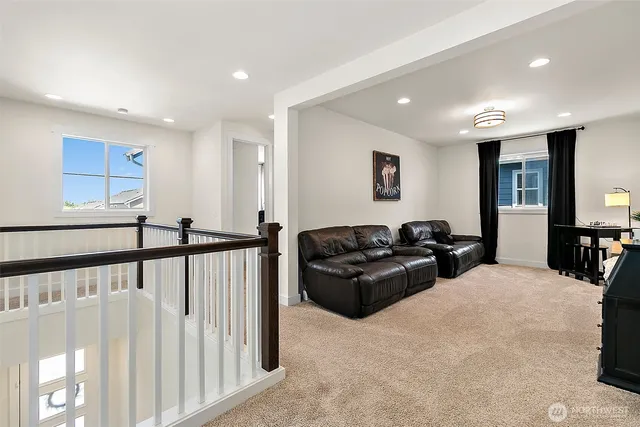 a bedroom with a bed a chandelier and a window