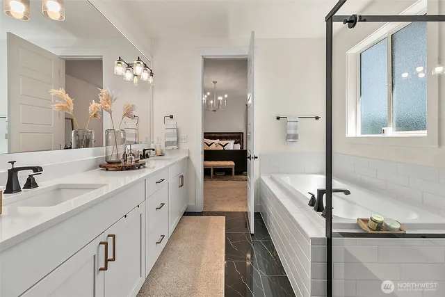 a bathroom with a bathtub and a shower