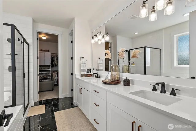 a living room with furniture a chandelier and a rug