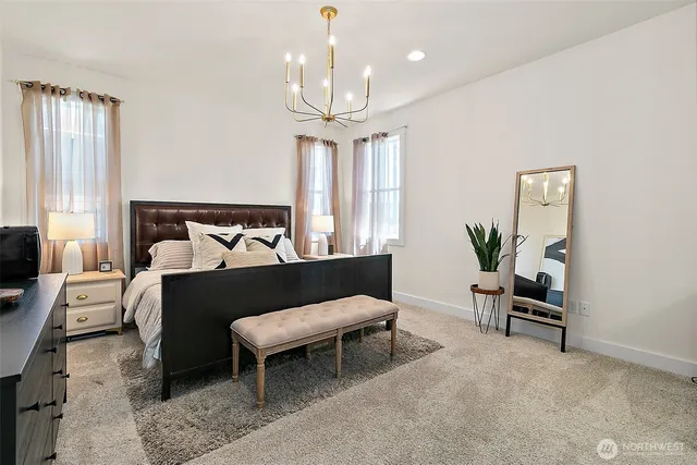 a view of an entryway with wooden floor and windows