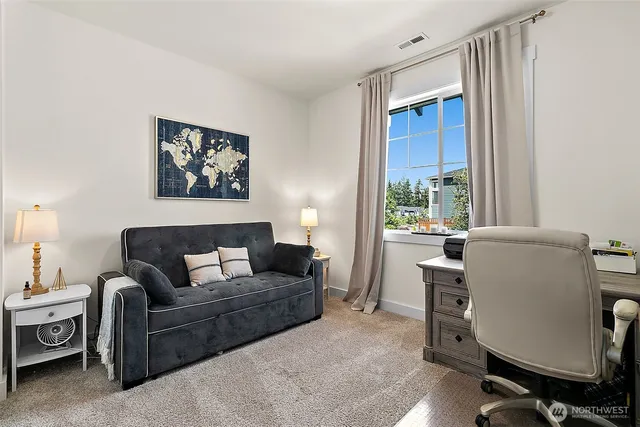 a view of a livingroom with furniture and a fireplace