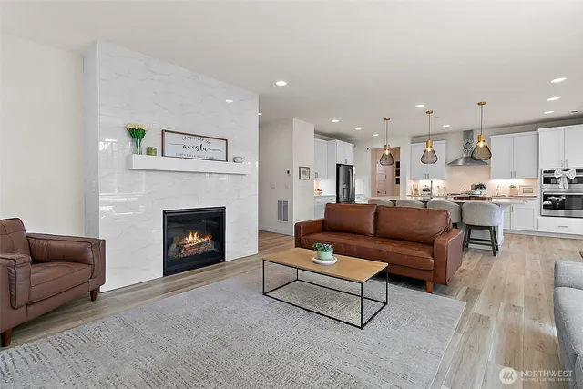 a view of a a dining room with furniture window and wooden floor