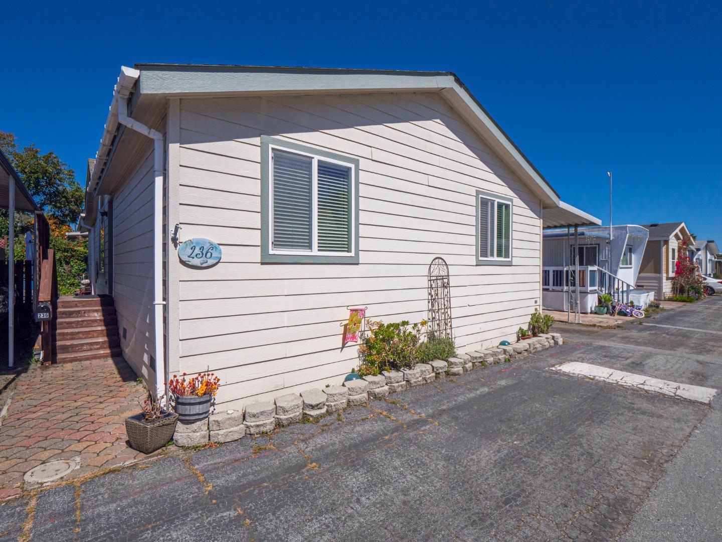 a view of a house with a yard and garage