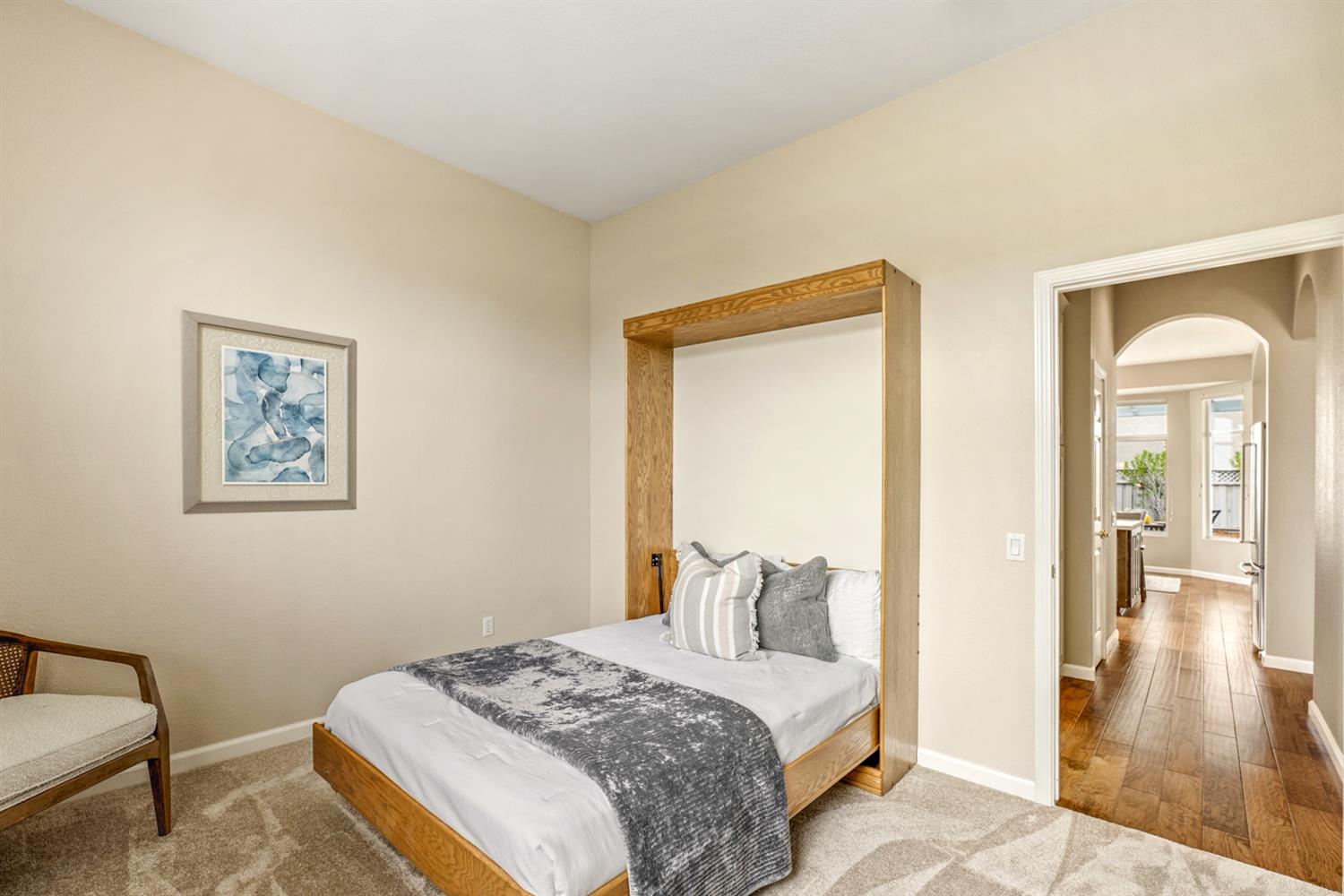 4081 Rose Creek Road Roseville, CA 95747 - Photo 33 of 52 a bedroom with a bed and wooden floor