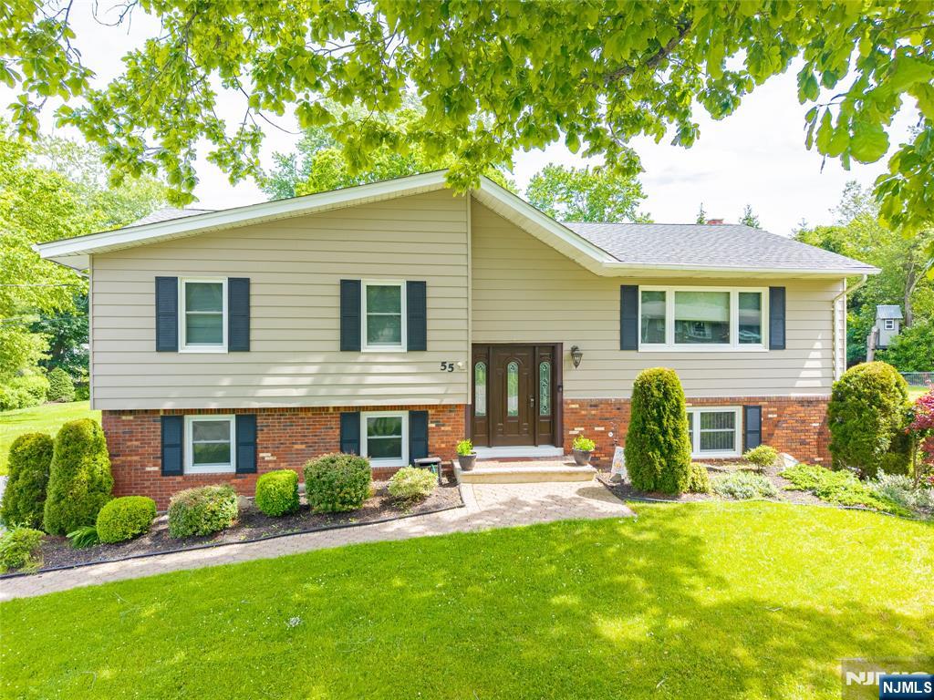 55 Marcia Road Ringwood, NJ 07456 - Photo 2 of 42 a front view of house with yard and green space