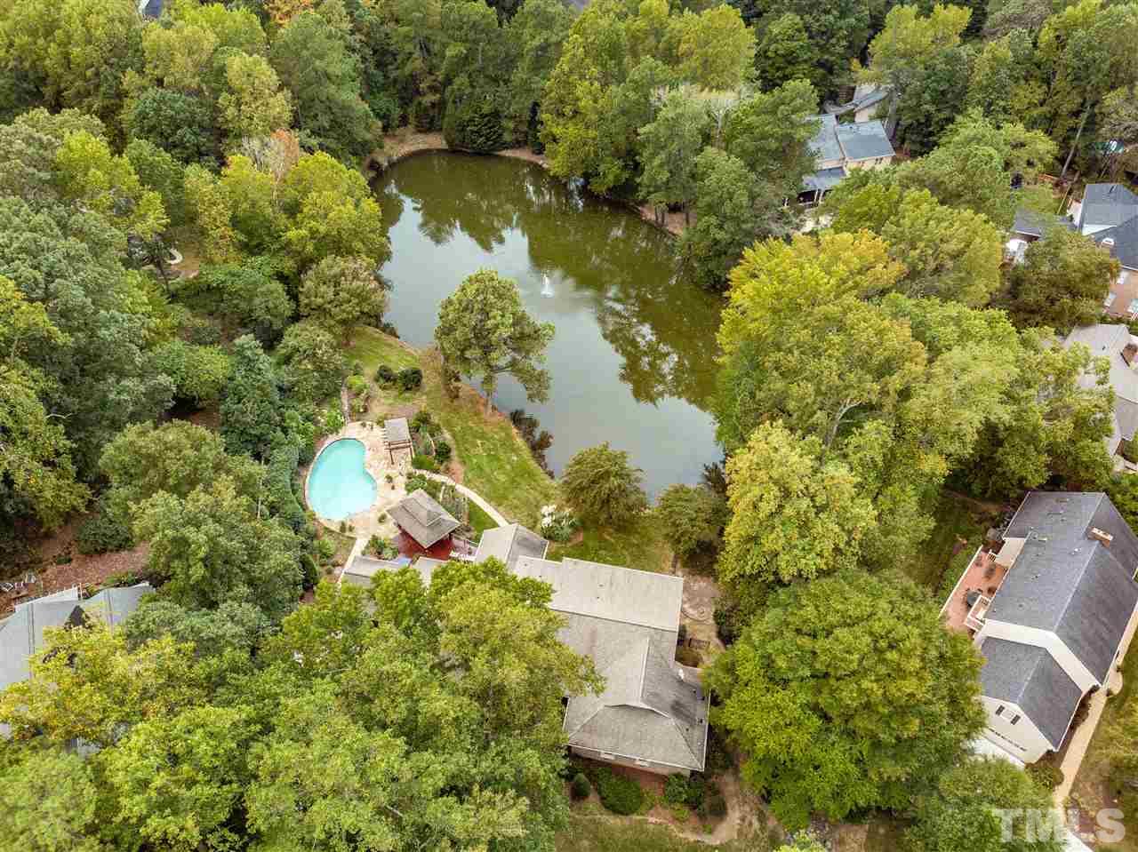 2008 Prescott Place Raleigh, NC 27615 - Photo 4 of 30 an aerial view of a house with a yard and lake view