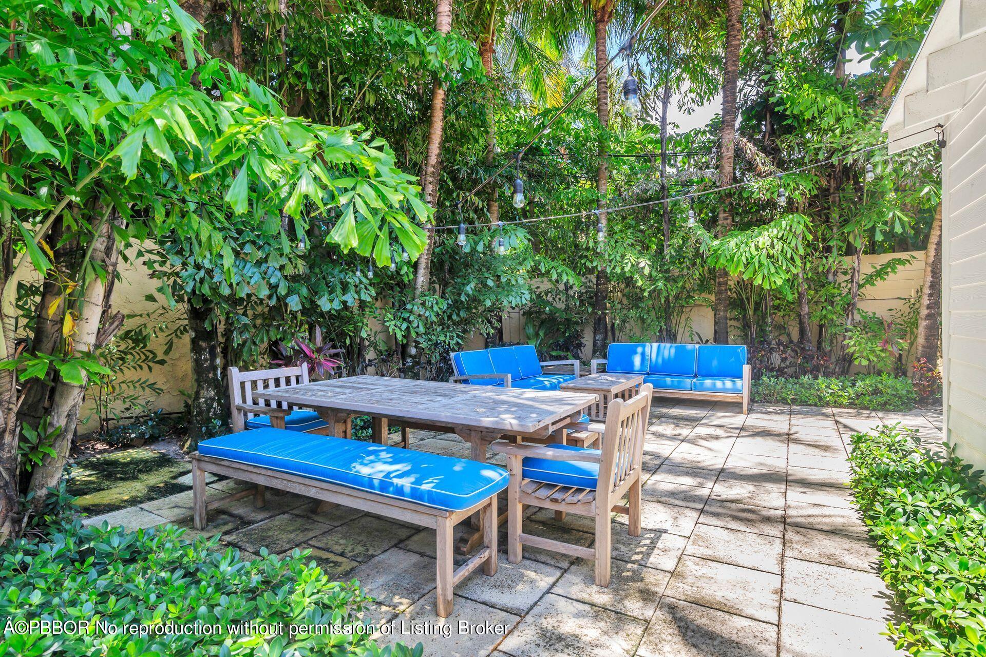 138 Root Trail Palm Beach, FL 33480 - Photo 16 of 23 a view of a backyard with sitting area