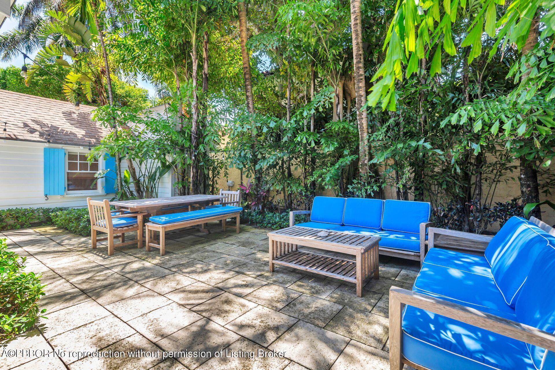 138 Root Trail Palm Beach, FL 33480 - Photo 17 of 23 a backyard of a house with outdoor seating