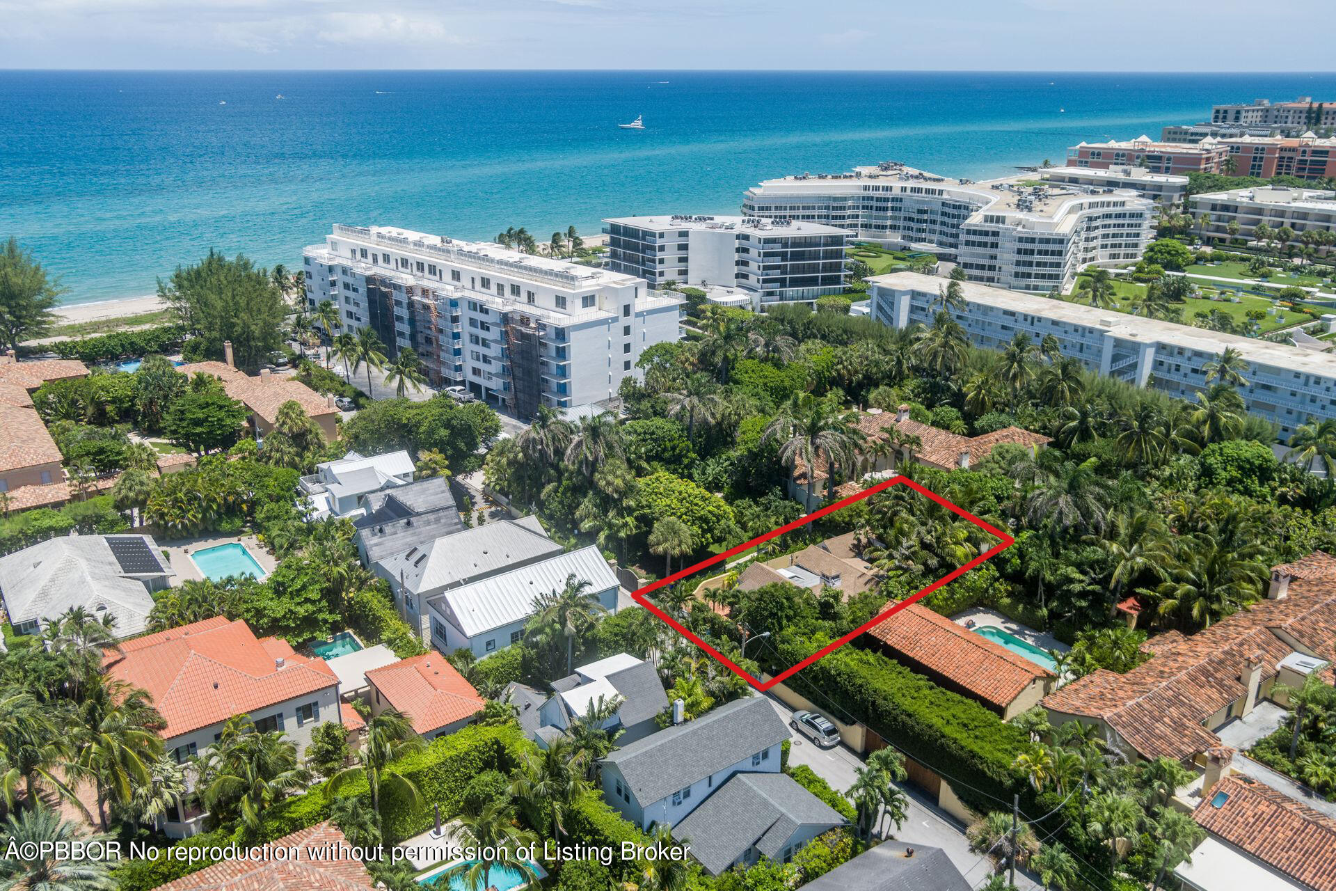 138 Root Trail Palm Beach, FL 33480 - Photo 20 of 23 an aerial view of a city with lots of residential buildings ocean and mountain view in back