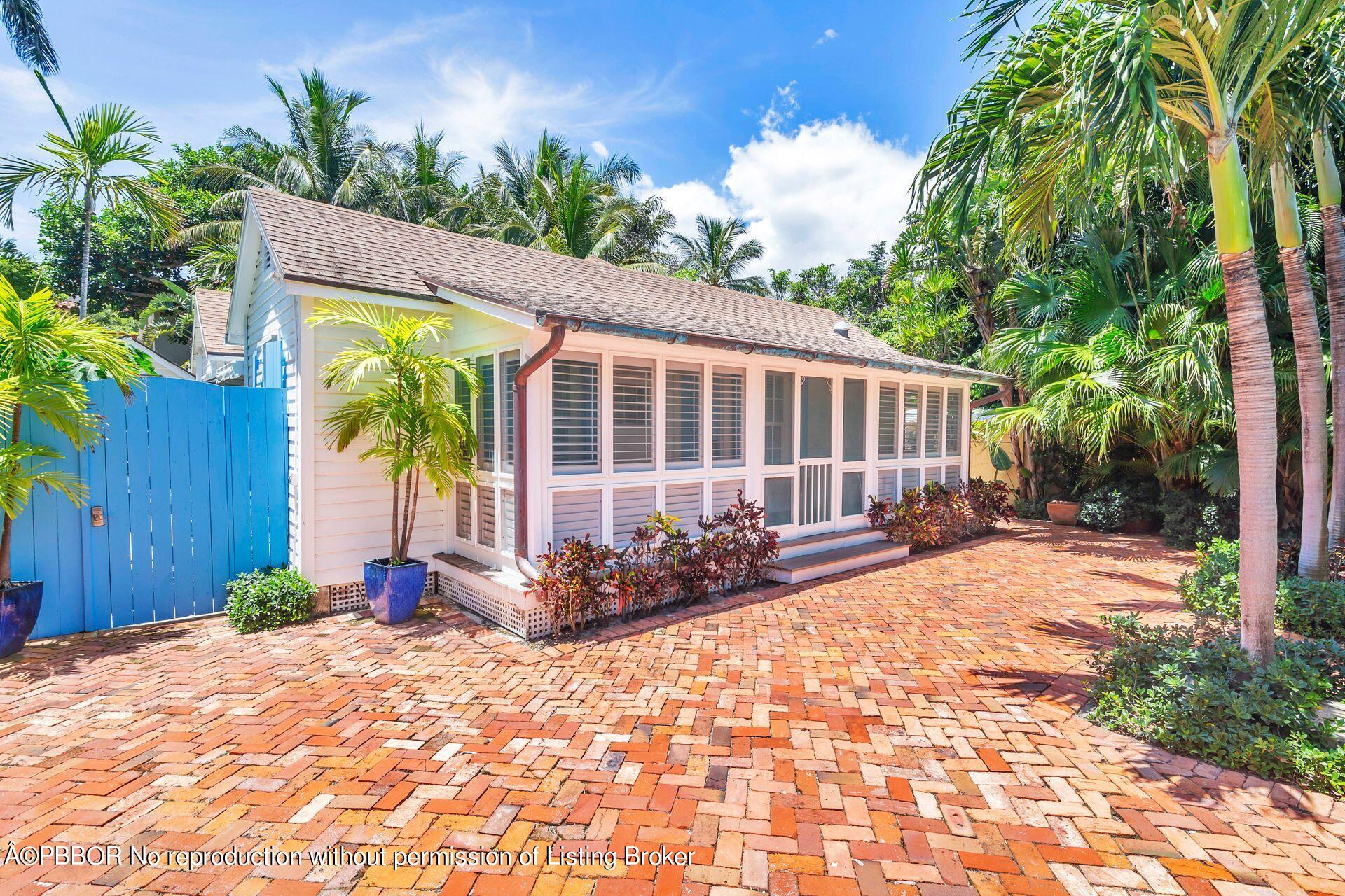 138 Root Trail Palm Beach, FL 33480 - Photo 2 of 23 a view of a lounge chair in the patio with a small yard