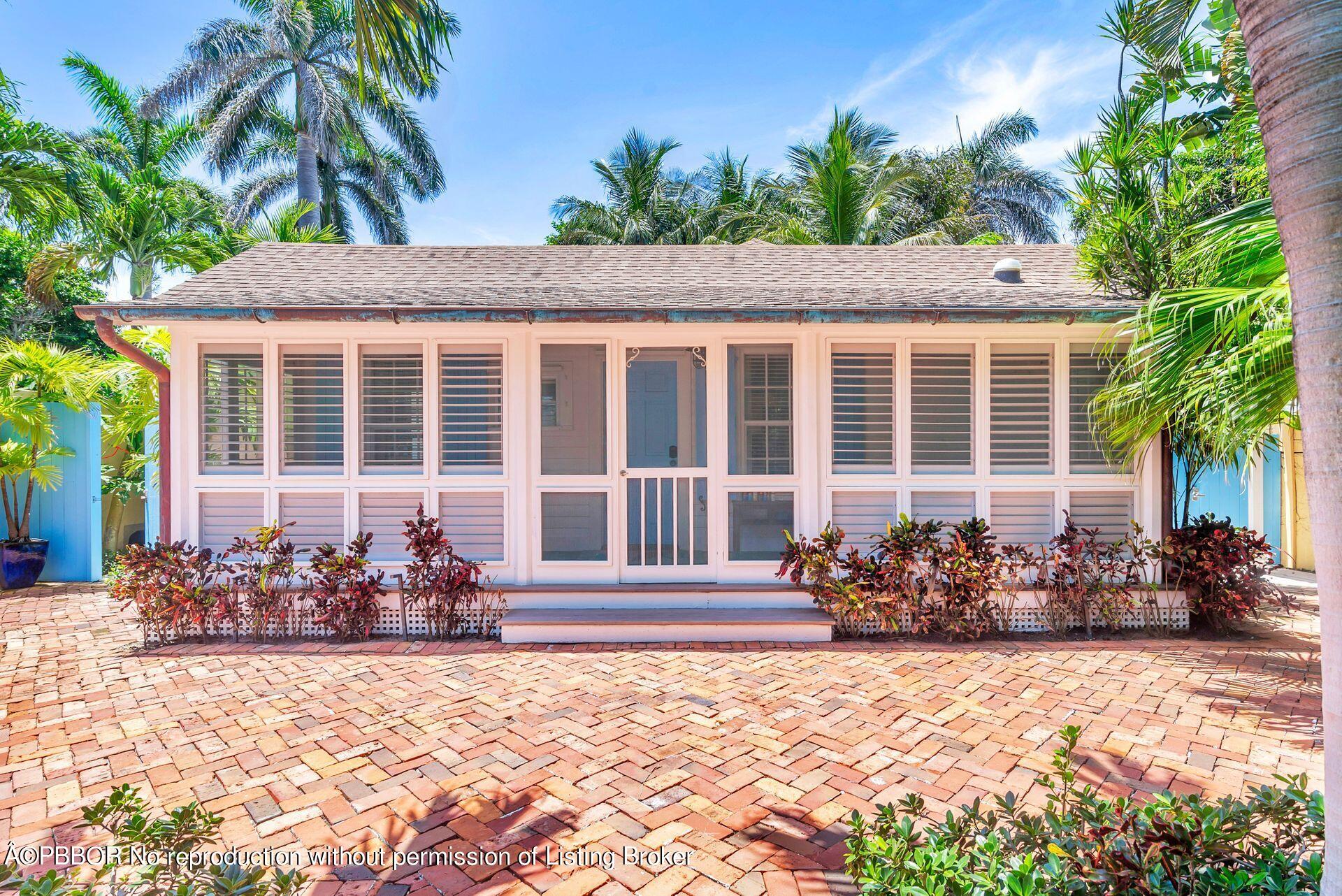 138 Root Trail Palm Beach, FL 33480 - Photo 3 of 23 a front view of a house
