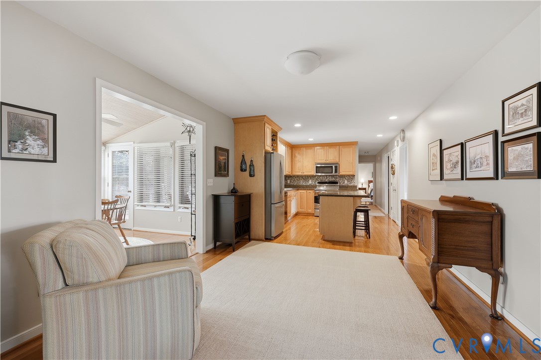 2326 Mill Road Powhatan, VA 23139 - Photo 12 of 50 a large living room with stainless steel appliances kitchen island granite countertop furniture and a large window