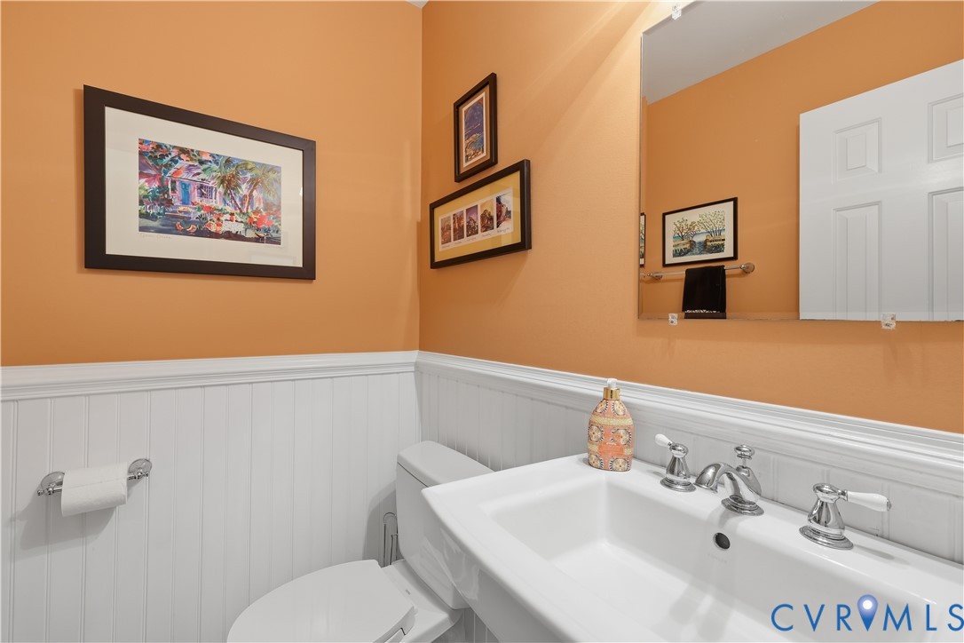 2326 Mill Road Powhatan, VA 23139 - Photo 17 of 50 a bathroom with a toilet a sink and mirror