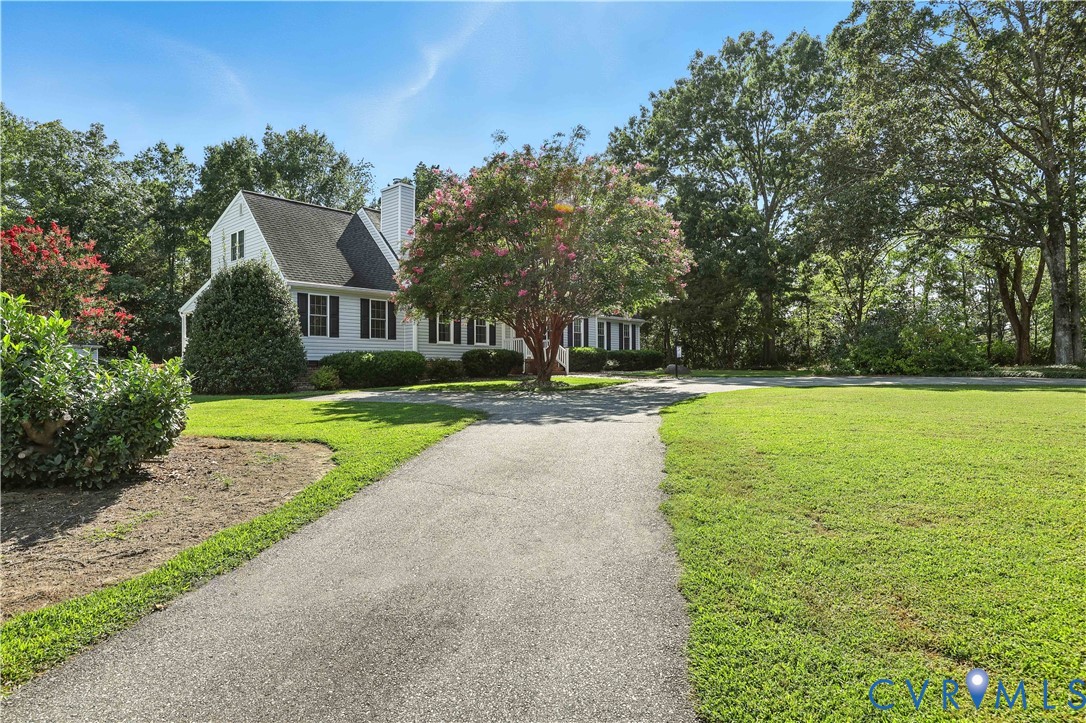 2326 Mill Road Powhatan, VA 23139 - Photo 2 of 50 a front view of a house with yard and green space