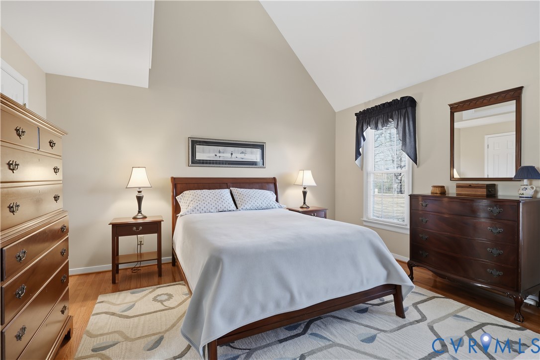 2326 Mill Road Powhatan, VA 23139 - Photo 20 of 50 a bedroom with a bed and wooden floor