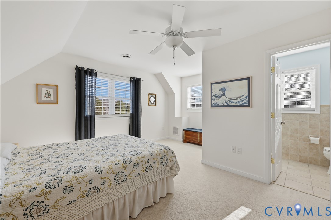 2326 Mill Road Powhatan, VA 23139 - Photo 34 of 50 a spacious bedroom with a bed and a chandelier