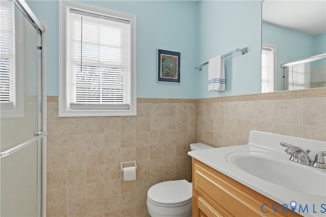 2326 Mill Road Powhatan, VA 23139 - Photo 35 of 50 a bathroom with a sink a toilet and a mirror