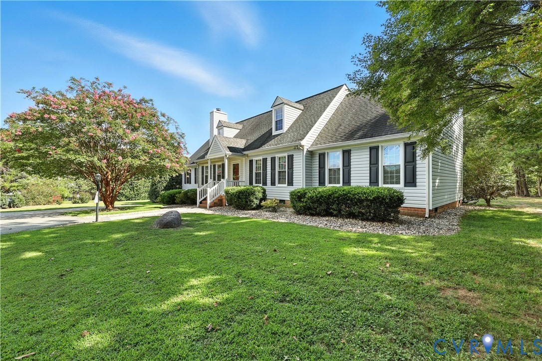 2326 Mill Road Powhatan, VA 23139 - Photo 42 of 50 a view of a house with a big yard potted plants and large tree