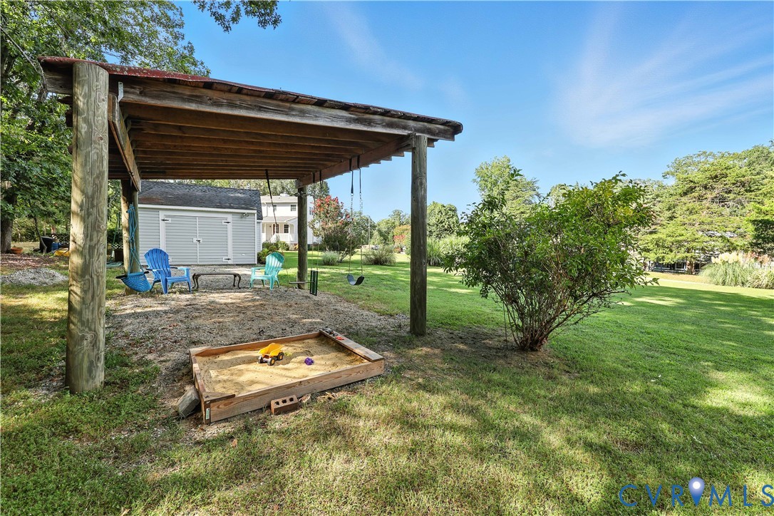 2326 Mill Road Powhatan, VA 23139 - Photo 45 of 50 a backyard of a house with table and chairs