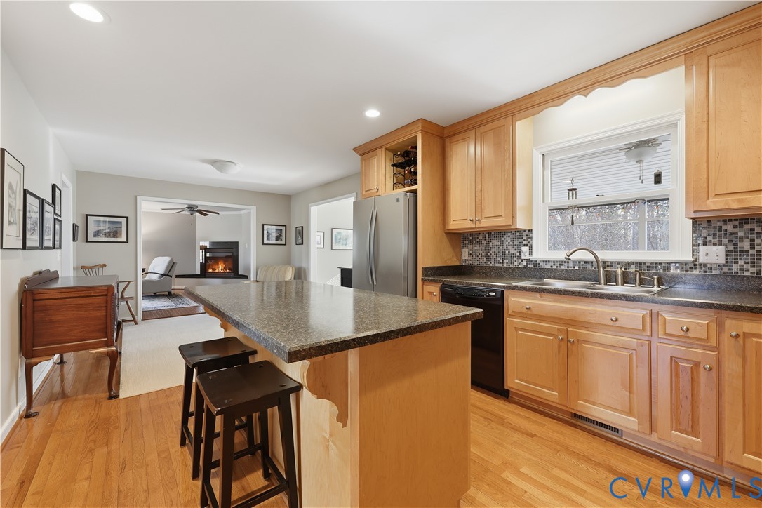 2326 Mill Road Powhatan, VA 23139 - Photo 5 of 50 a kitchen with stainless steel appliances granite countertop a refrigerator a stove and white cabinets with wooden floor