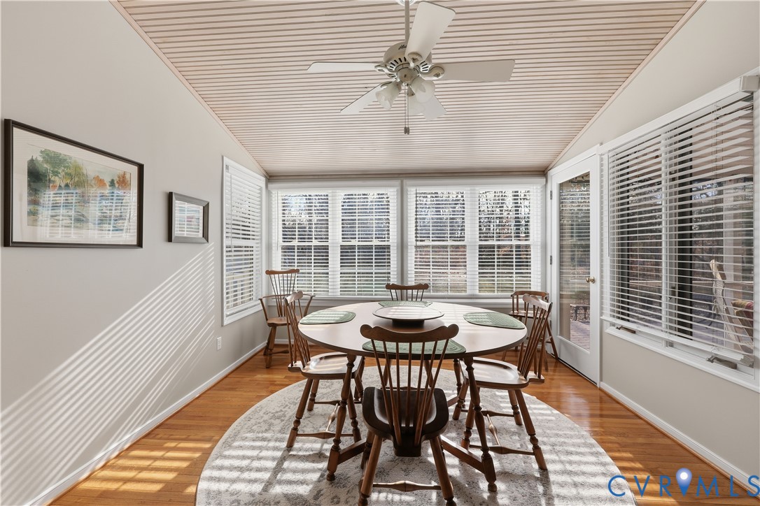 2326 Mill Road Powhatan, VA 23139 - Photo 7 of 50 a dining room with furniture a chandelier and wooden floor