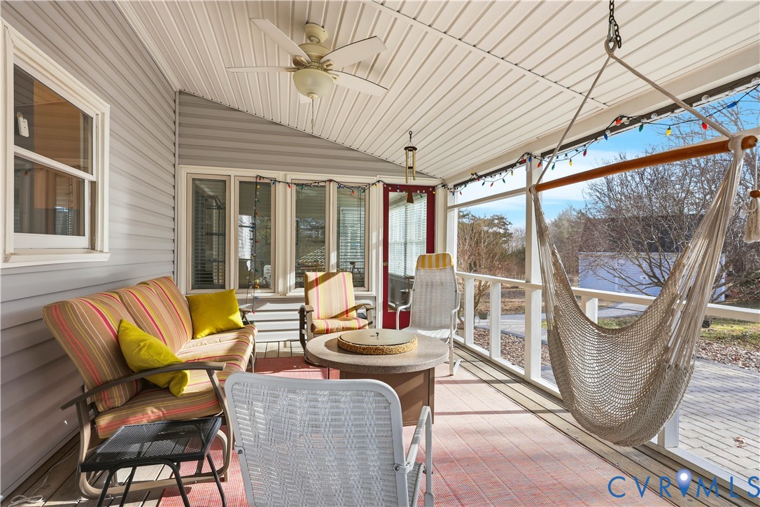 2326 Mill Road Powhatan, VA 23139 - Photo 9 of 50 a living room filled with furniture and a floor to ceiling window
