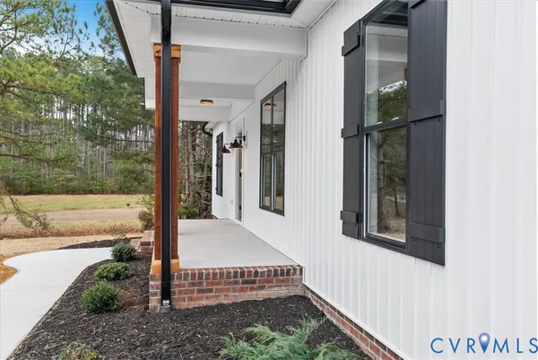 a kitchen with stainless steel appliances kitchen island granite countertop a stove a sink and a refrigerator