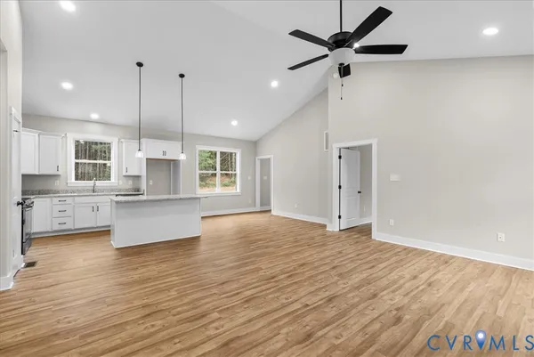 a kitchen with granite countertop a sink and a window