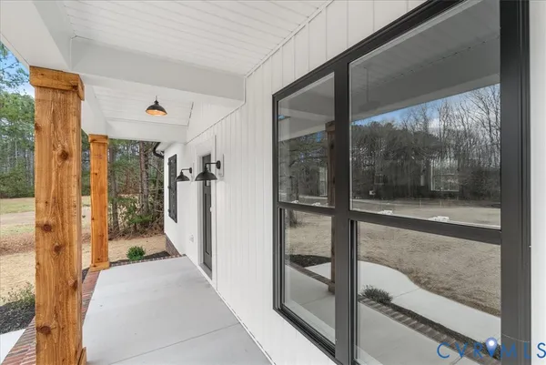 a view of a glass door and a living room