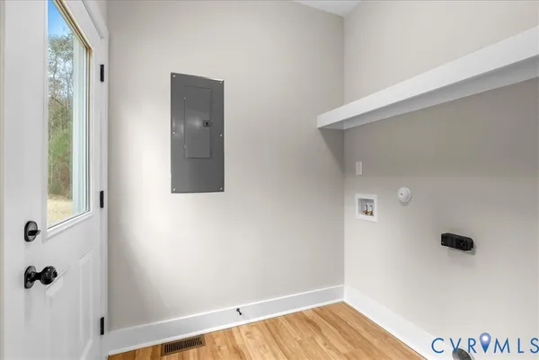a bathroom with a granite countertop toilet sink and mirror