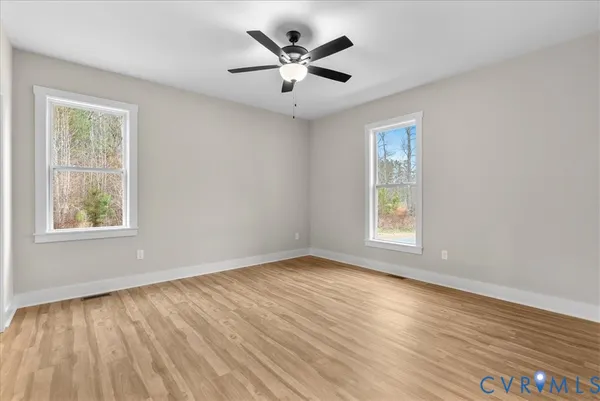 a view of hallway with wooden floor and front door