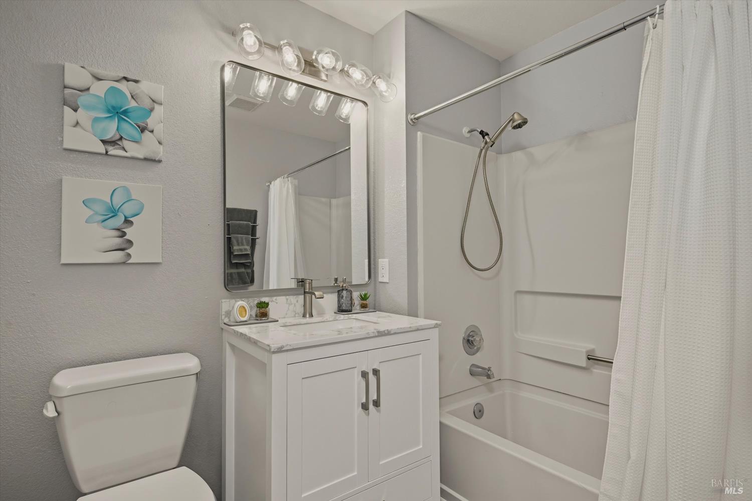 8201 Camino Colegio, Unit 122 Rohnert Park, CA 94928 - Photo 11 of 27 a bathroom with a sink toilet and shower