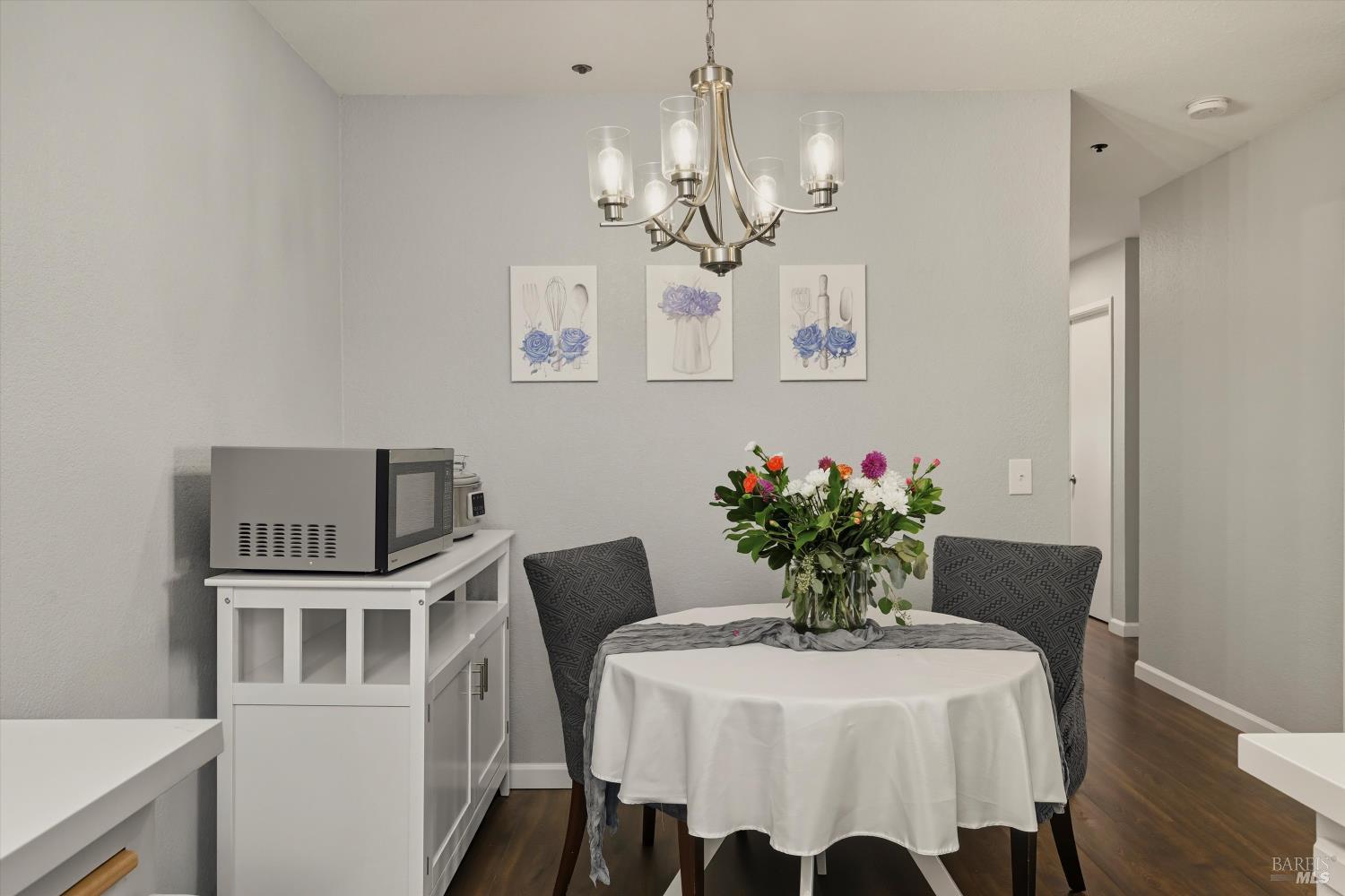 8201 Camino Colegio, Unit 122 Rohnert Park, CA 94928 - Photo 7 of 27 a view of a dining room with furniture and a chandelier